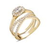 1 CT. T.W. Oval Diamond Sideways Frame Criss-Cross Bridal Set in 14K Gold