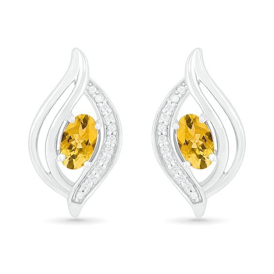 Oval Citrine and 1/20 CT. T.w. Diamond Bypass Flame Stud Earrings in Sterling Silver