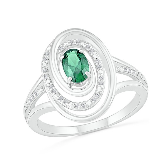 Oval Emerald and 1/15 CT. T.W. Diamond Beaded Open Swirl Frame Triple Row Split Shank Ring in Sterling Silver Oval Emerald and 1/15 CT. T.W. Diamond Beaded Open Swirl Frame Triple Row Split Shank Ring in Sterling Silver