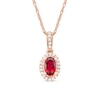 Thumbnail Image 0 of Oval Ruby and 1/20 CT. T.W. Diamond Framed Vintage-Style Drop Pendant in 10K Rose Gold