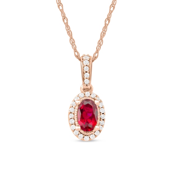 Oval Ruby and 1/20 CT. T.w. Diamond Framed Vintage-Style Drop Pendant in 10K Rose Gold
