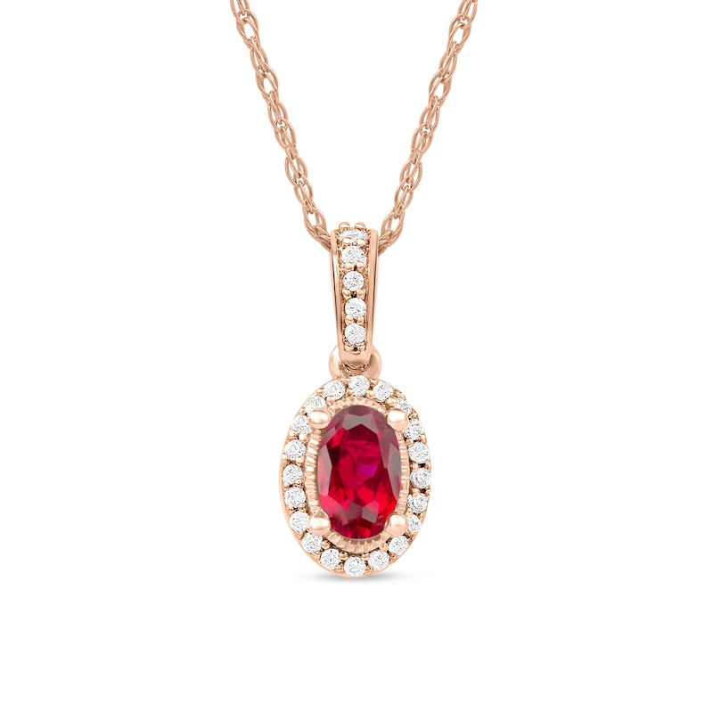 Oval Ruby and 1/20 CT. T.W. Diamond Framed Vintage-Style Drop Pendant in 10K Rose Gold