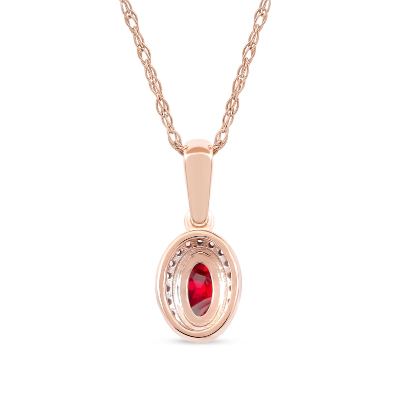 Oval Ruby and 1/20 CT. T.W. Diamond Framed Vintage-Style Drop Pendant in 10K Rose Gold