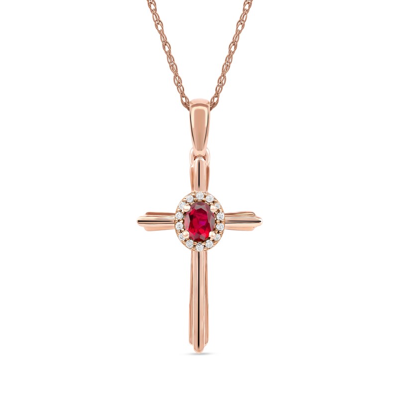 Main Image 1 of Oval Ruby and 1/20 CT. T.W. Diamond Frame Layered Cross Pendant in 10K Rose Gold