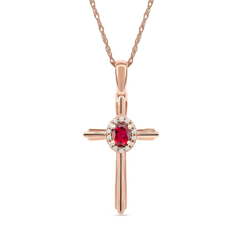 Oval Ruby and 1/20 CT. T.W. Diamond Frame Layered Cross Pendant in 10K Rose Gold