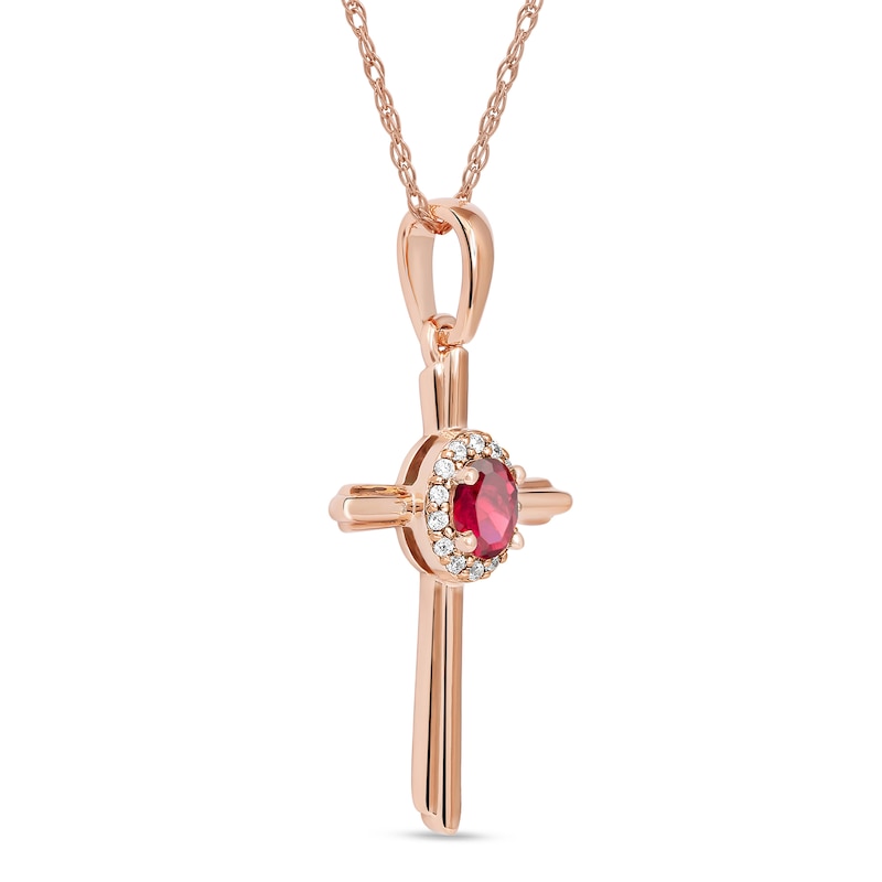 Oval Ruby and 1/20 CT. T.W. Diamond Frame Layered Cross Pendant in 10K Rose Gold