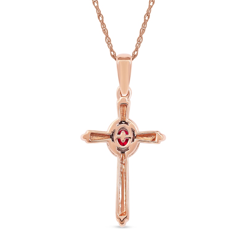 Oval Ruby and 1/20 CT. T.W. Diamond Frame Layered Cross Pendant in 10K Rose Gold