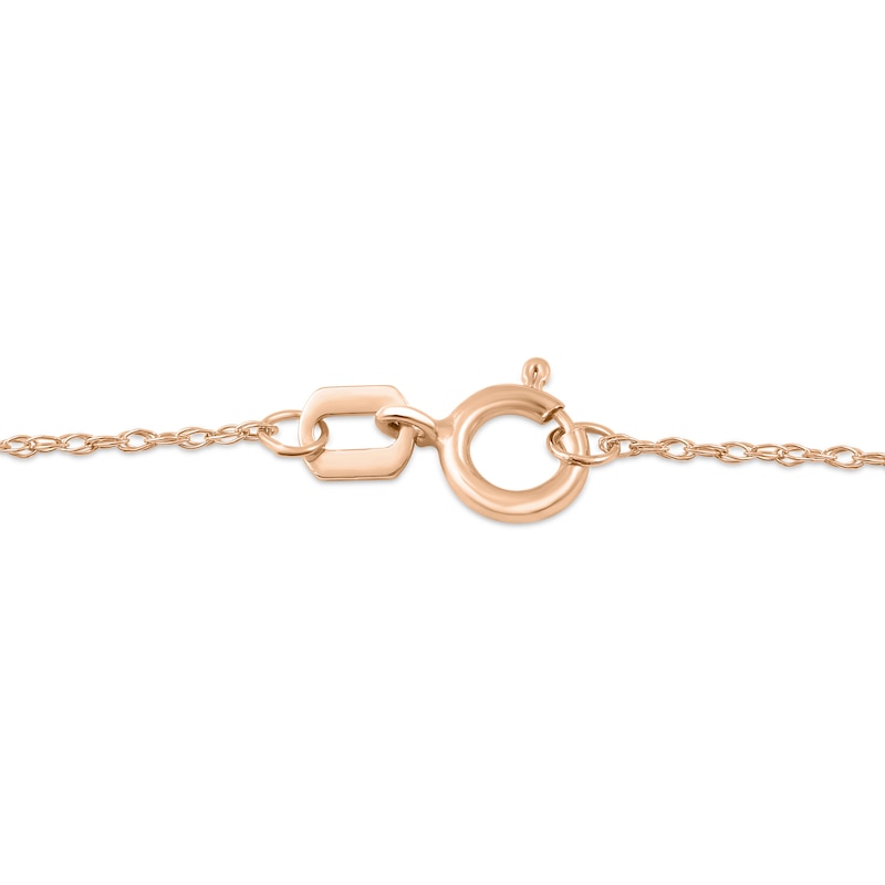 Main Image 4 of Oval Ruby and 1/20 CT. T.W. Diamond Frame Layered Cross Pendant in 10K Rose Gold
