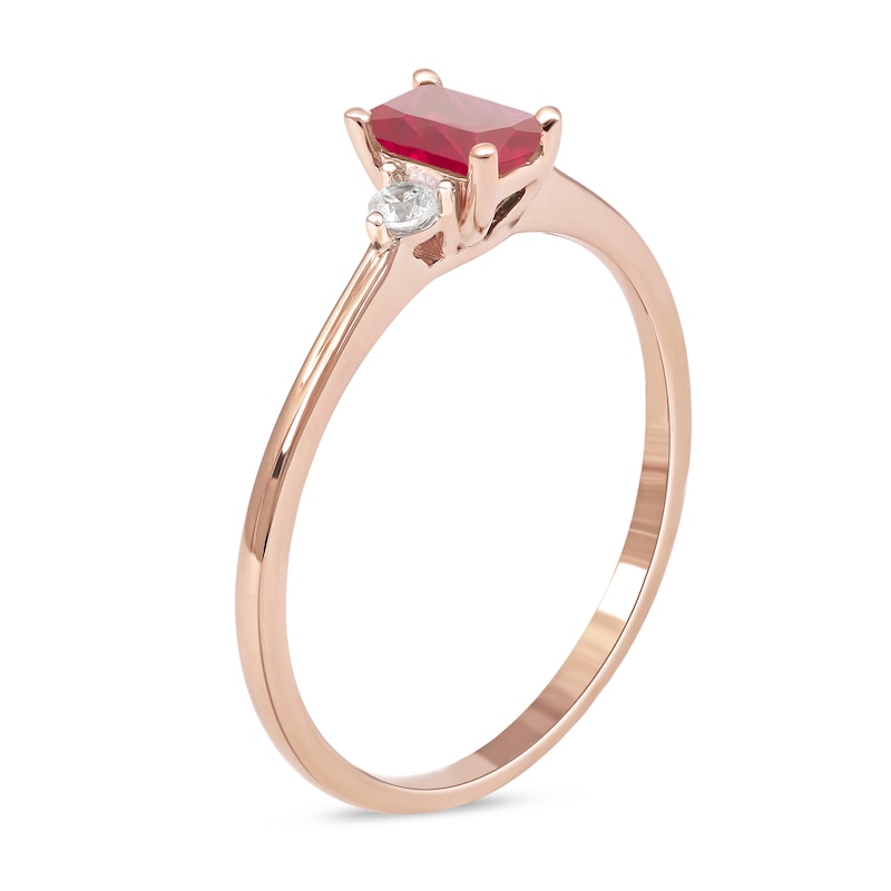 Main Image 2 of Emerald-Cut Ruby and 1/15 CT. T.W. Diamond Three Stone Grooved Ring in 10K Rose Gold