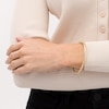Thumbnail Image 2 of Italian Gold 60.0 x 50.0 x 4.0mm Twist Bangle in Hollow 14K Gold