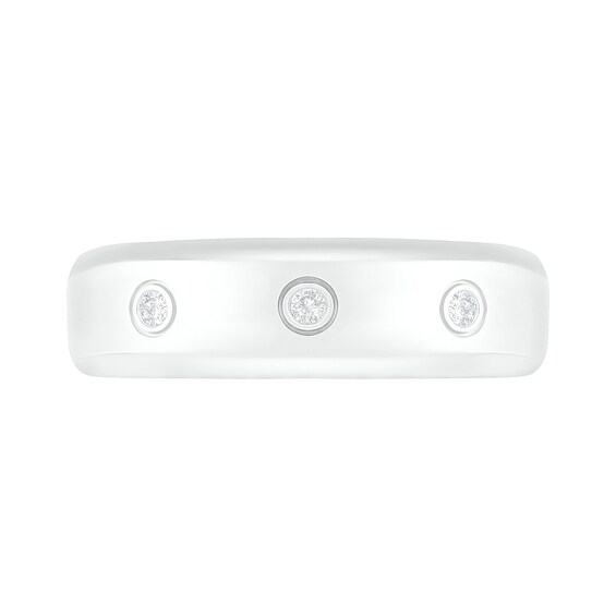 1/15 CT. T.w. Diamond Three Stone Station Wedding Band in 10K White Gold