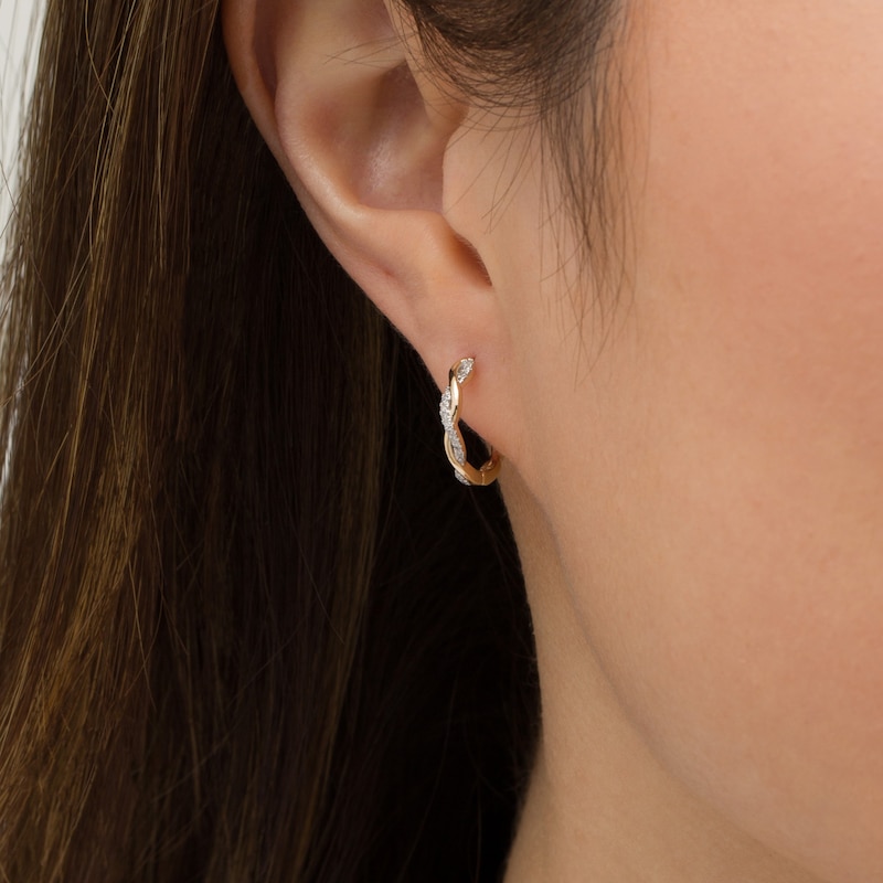 Main Image 2 of 1/10 CT. T.W. Diamond Twist Huggie Hoop Earrings in 10K Gold