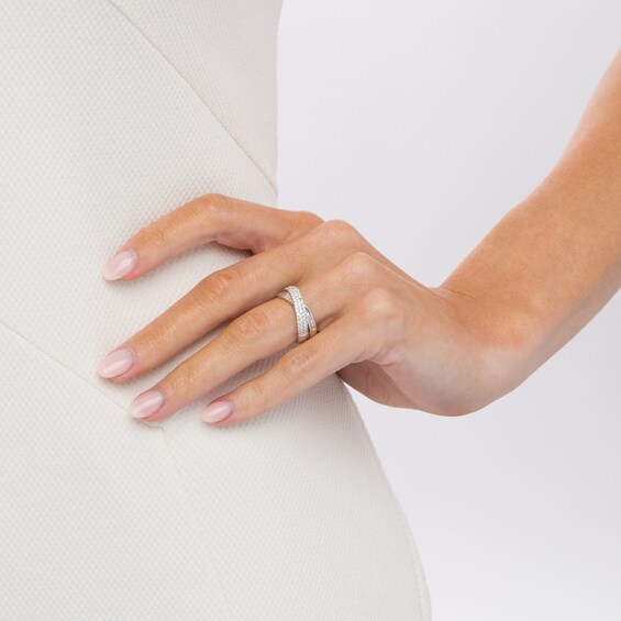 1/2 CT. T.w. Baguette and Round Diamond Crossover Anniversary Band in 10K Gold