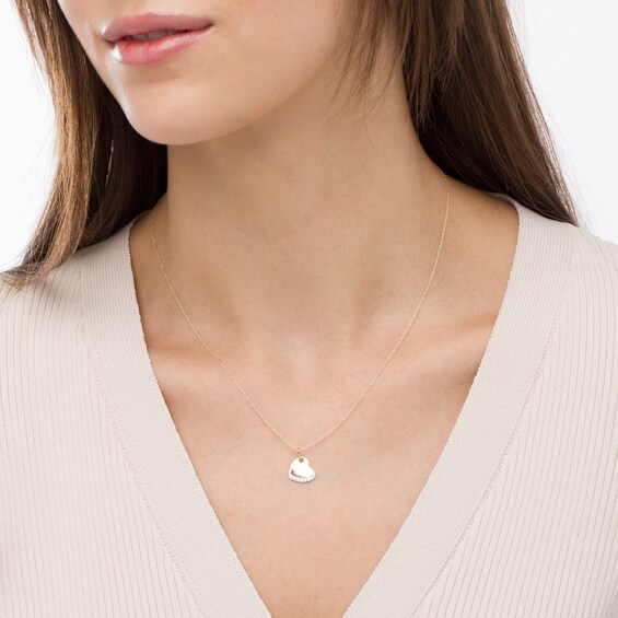 1/15 CT. T.w. Diamond Tilted Heart Pendant in 10K Gold