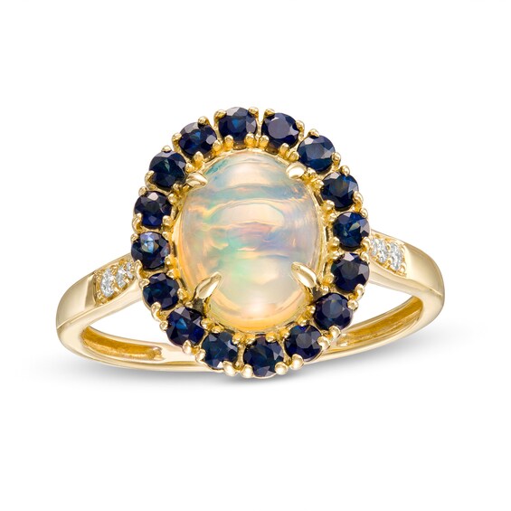 Captivating Color Oval Opal, Round Blue Sapphire and 1/20 CT. T.w. Diamond Frame Ring in 14K Gold