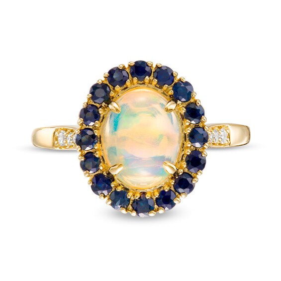 Captivating Color Oval Opal, Round Blue Sapphire and 1/20 CT. T.w. Diamond Frame Ring in 14K Gold