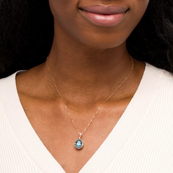 Captivating Color Oval London Blue Topaz, Pink Rhodolite Garnet, Blue Sapphire and Diamond Accent Pendant in 14K Gold