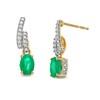 Thumbnail Image 1 of Oval Emerald and 1/6 CT. T.W. Diamond Bypass Ribbon Loop Drop Earrings in 10K Gold