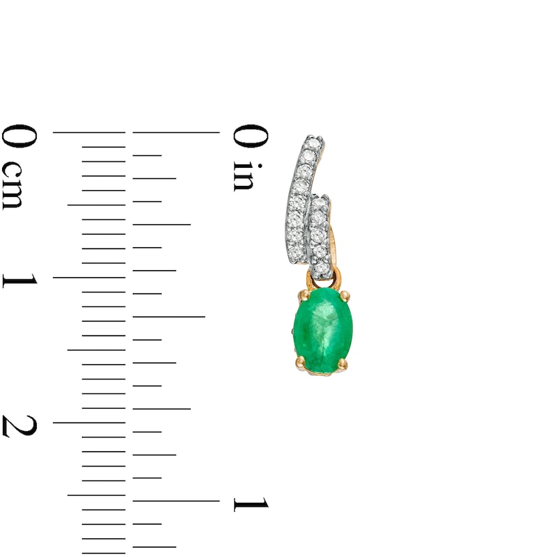 Main Image 3 of Oval Emerald and 1/6 CT. T.W. Diamond Bypass Ribbon Loop Drop Earrings in 10K Gold