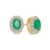 Thumbnail Image 1 of Oval Emerald and 1/8 CT. T.W. Diamond Frame Ornate Stud Earrings in 10K Gold