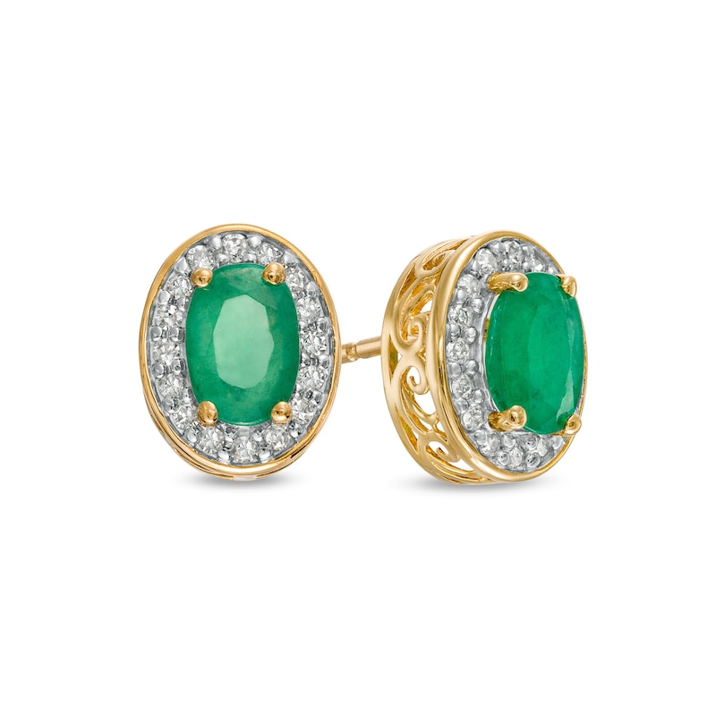 Main Image 1 of Oval Emerald and 1/8 CT. T.W. Diamond Frame Ornate Stud Earrings in 10K Gold