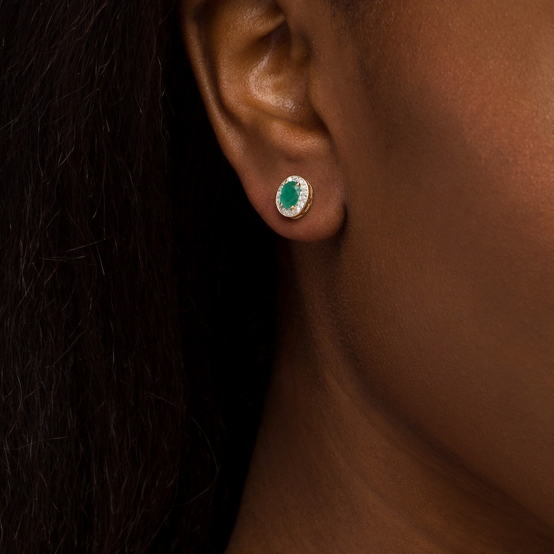 Main Image 2 of Oval Emerald and 1/8 CT. T.W. Diamond Frame Ornate Stud Earrings in 10K Gold