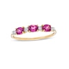 Thumbnail Image 1 of Sideways Oval Rhodolite Garnet and 1/15 CT. T.W. Diamond Three Stone Ring in 10K Gold