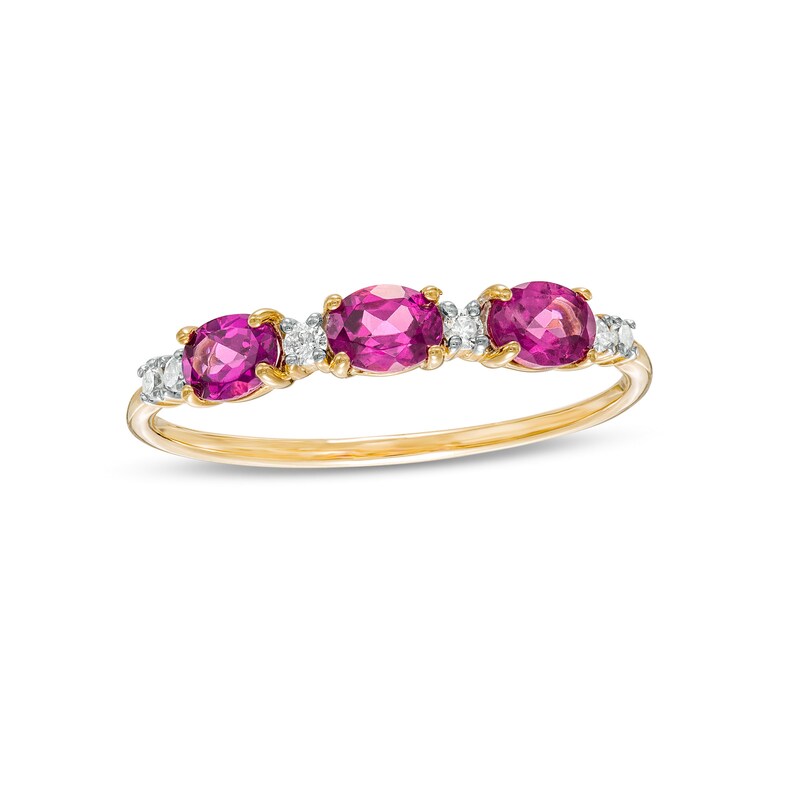 Main Image 1 of Sideways Oval Rhodolite Garnet and 1/15 CT. T.W. Diamond Three Stone Ring in 10K Gold