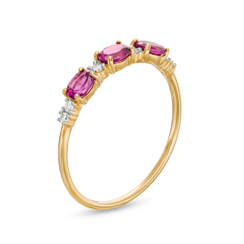 Main Image 3 of Sideways Oval Rhodolite Garnet and 1/15 CT. T.W. Diamond Three Stone Ring in 10K Gold