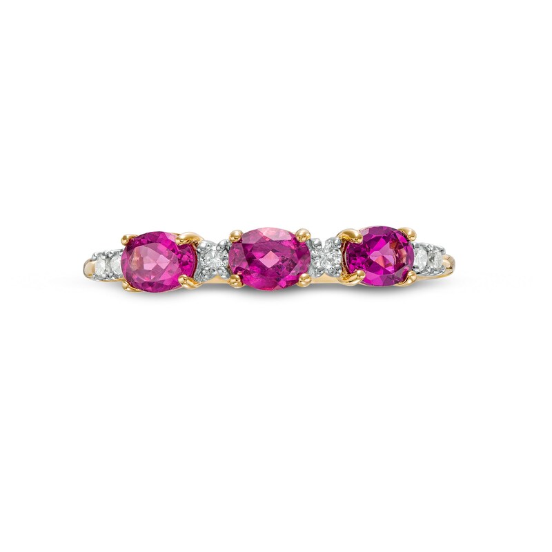 Main Image 4 of Sideways Oval Rhodolite Garnet and 1/15 CT. T.W. Diamond Three Stone Ring in 10K Gold