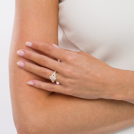 1-1/5 CT. T.w. Marquise Diamond Frame Floral Sides Engagement Ring in 14K Gold (I/Si2)