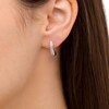Thumbnail Image 2 of 1/8 CT. T.W. Baguette Diamond Hoop Earrings in 10K White Gold