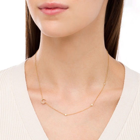 1/8 CT. T.w. Diamond Crescent Moon Station Necklace in 10K Gold