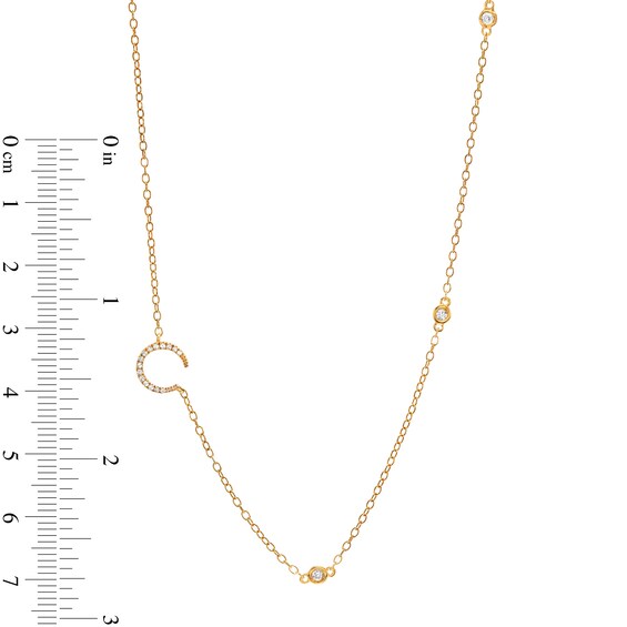 1/8 CT. T.w. Diamond Crescent Moon Station Necklace in 10K Gold
