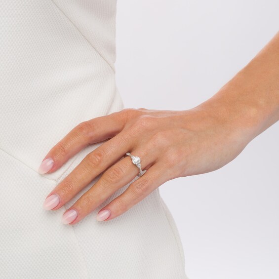 1/3 CT. T.w. Oval Diamond Frame Twist Shank Engagement Ring in 14K White Gold (I/Si2)