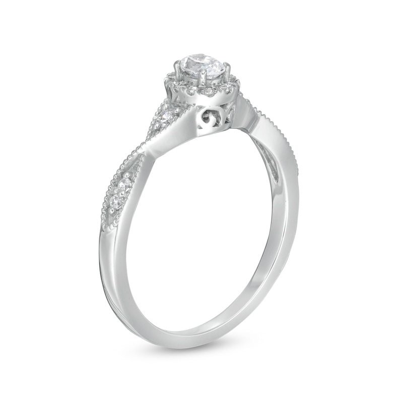 1/3 CT. T.W. Oval Diamond Frame Twist Shank Engagement Ring in 14K White Gold (I/SI2)