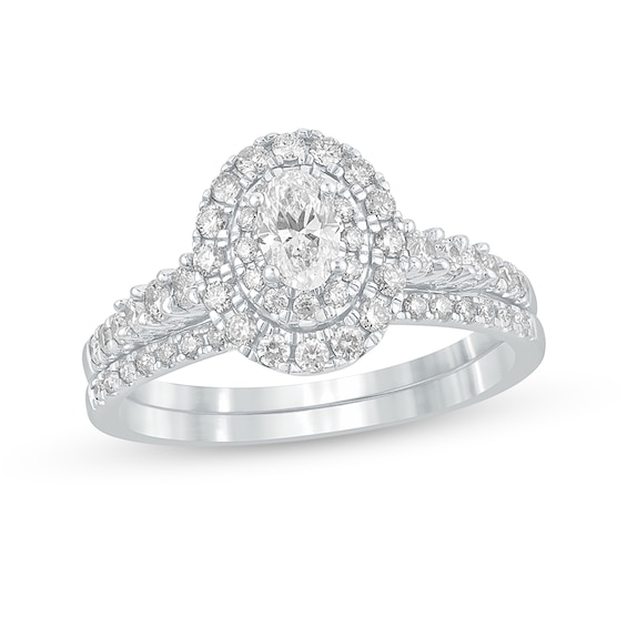 1 CT. T.w. Oval Diamond Frame Bridal Set in 10K White Gold