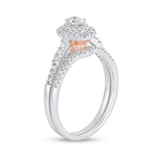 1/2 CT. T.w. Oval Diamond Frame Bridal Set in 10K White Gold