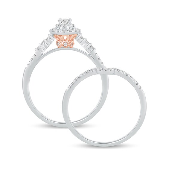 1/2 CT. T.w. Oval Diamond Frame Bridal Set in 10K White Gold