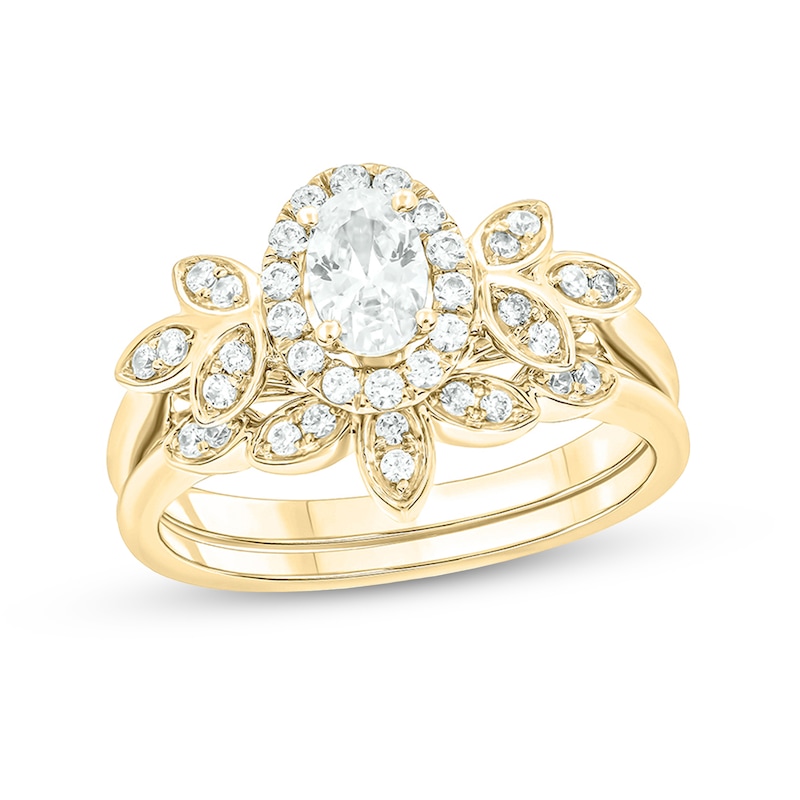 Main Image 1 of 3/4 CT. T.W. Oval Diamond Frame Tri-Sides Leaf Bridal Set in 14K Gold (I/I2)