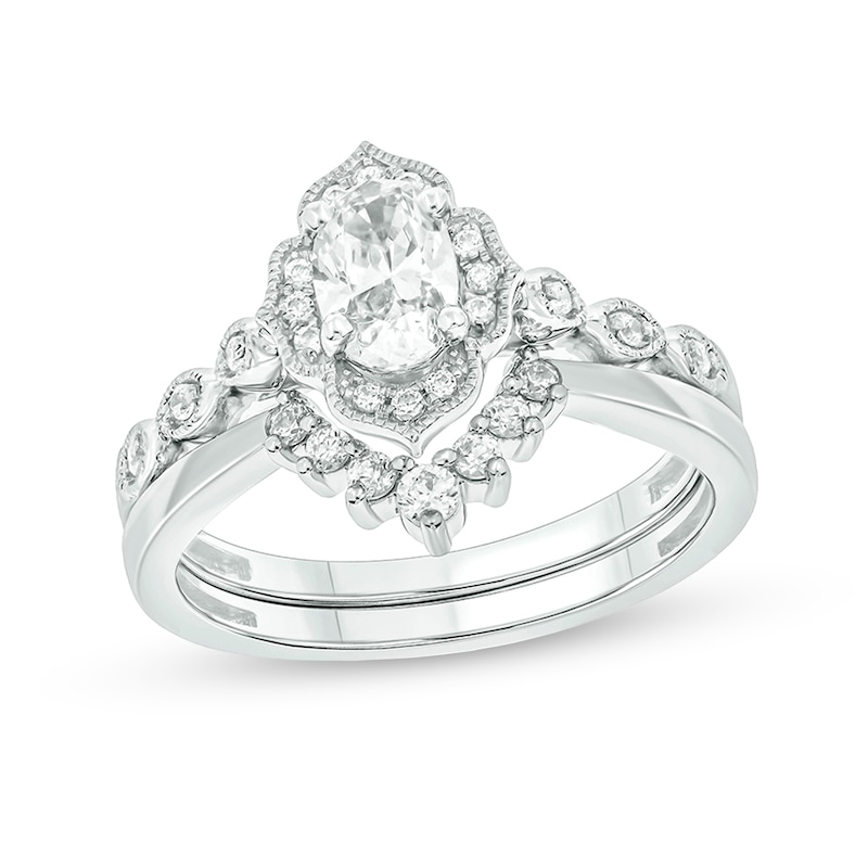 Main Image 1 of 3/4 CT. T.W. Oval Diamond Frame Vintage-Style Bridal Set in 14K White Gold (I/I2)