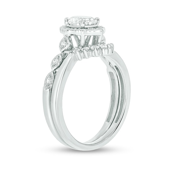 3/4 CT. T.w. Oval Diamond Frame Vintage-Style Bridal Set in 14K White Gold (I/I2)