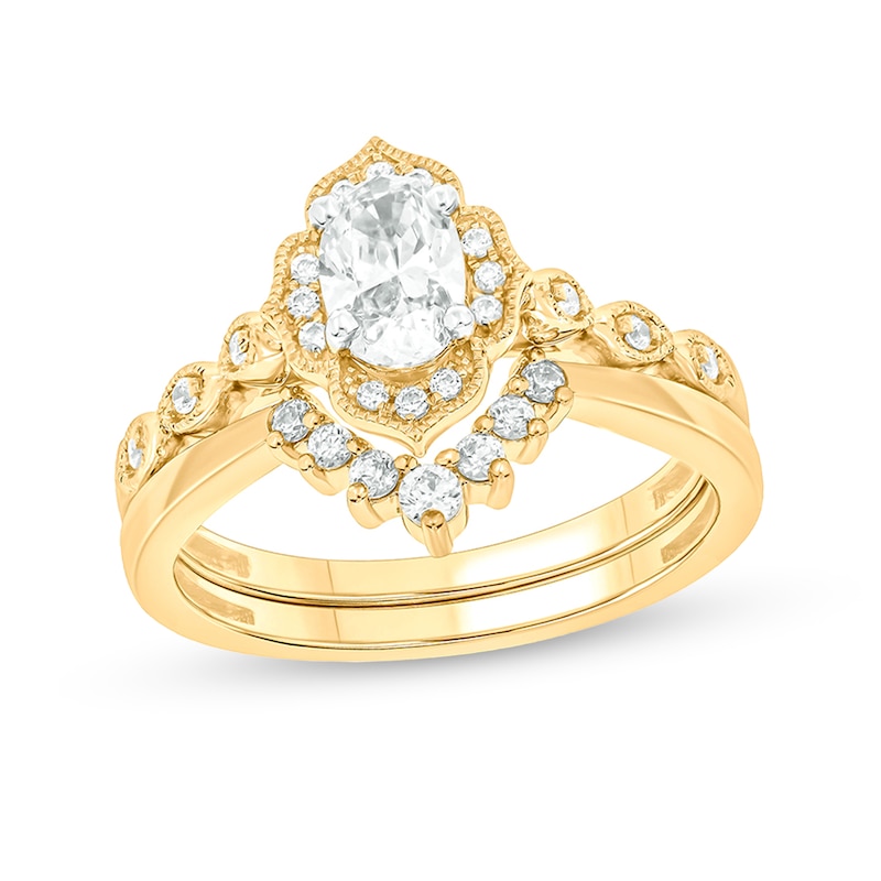 Main Image 1 of 3/4 CT. T.W. Oval Diamond Frame Vintage-Style Bridal Set in 14K Gold (I/I2)