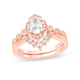 3/4 CT. T.W. Oval Diamond Frame Vintage-Style Bridal Set in 14K Rose Gold (I/I2)