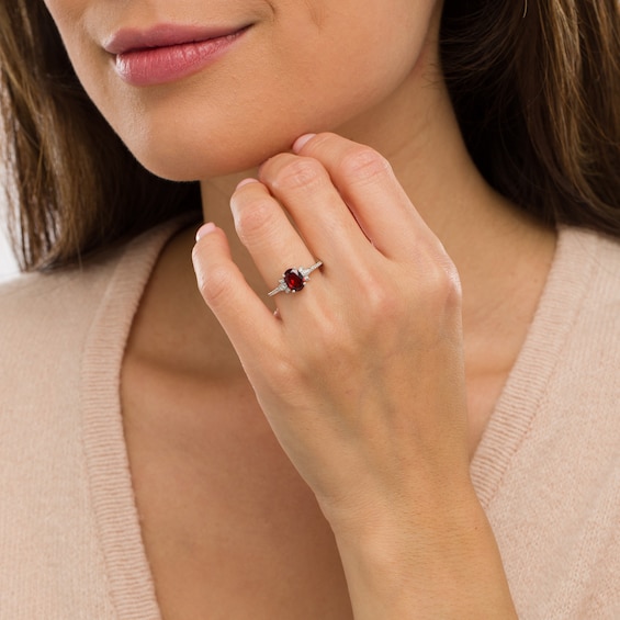 Oval Garnet and 1/10 CT. T.w. Diamond Leaf-Sides Floral Ring in 10K White Gold
