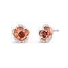 Thumbnail Image 0 of Enchanted Disney Snow White 3.0mm Garnet and 1/10 CT. T.W. Diamond Flower Stud Earrings in 10K Rose Gold