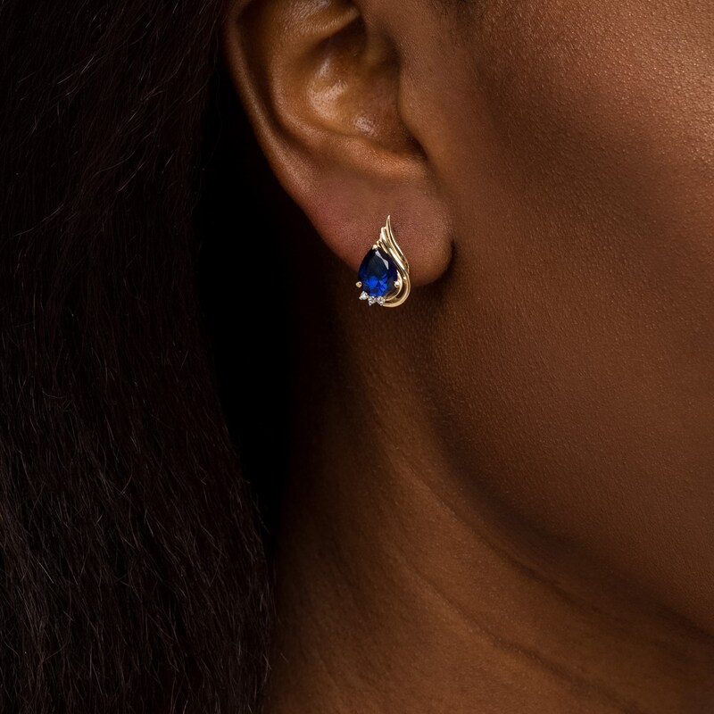 Pear-Shaped Blue Lab-Created Sapphire and 1/20 CT. T.W. Diamond Flame Stud Earrings in 10K Gold