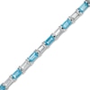 Thumbnail Image 1 of Baguette Swiss Blue Topaz and White Lab-Created Sapphire Alternating Line Bracelet in Sterling Silver - 7.25"