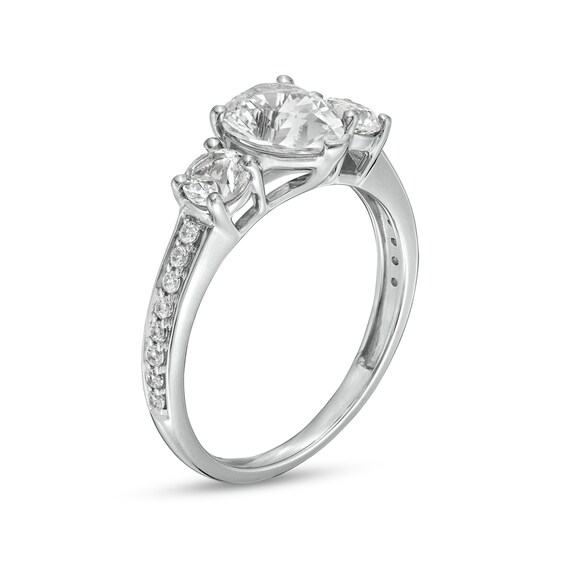 Pear-Shaped White Lab-Created Sapphire and 1/6 CT. T.w. Diamond Three Stone Engagement Ring in 10K White Gold