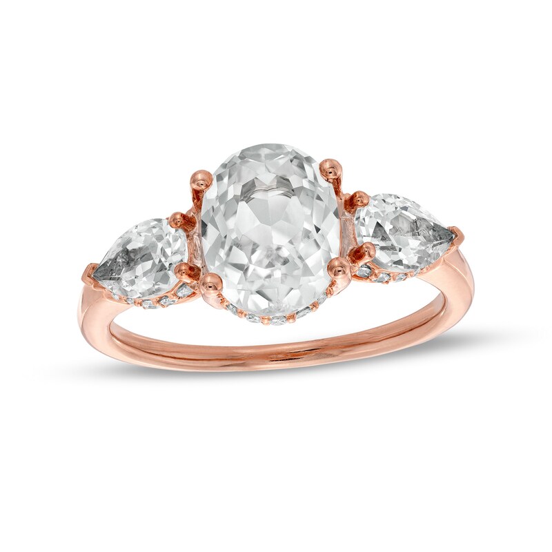 Main Image 1 of Oval White Lab-Created Sapphire and 1/6 CT. T.W. Diamond Frame Three Stone Engagement Ring in 10K Rose Gold
